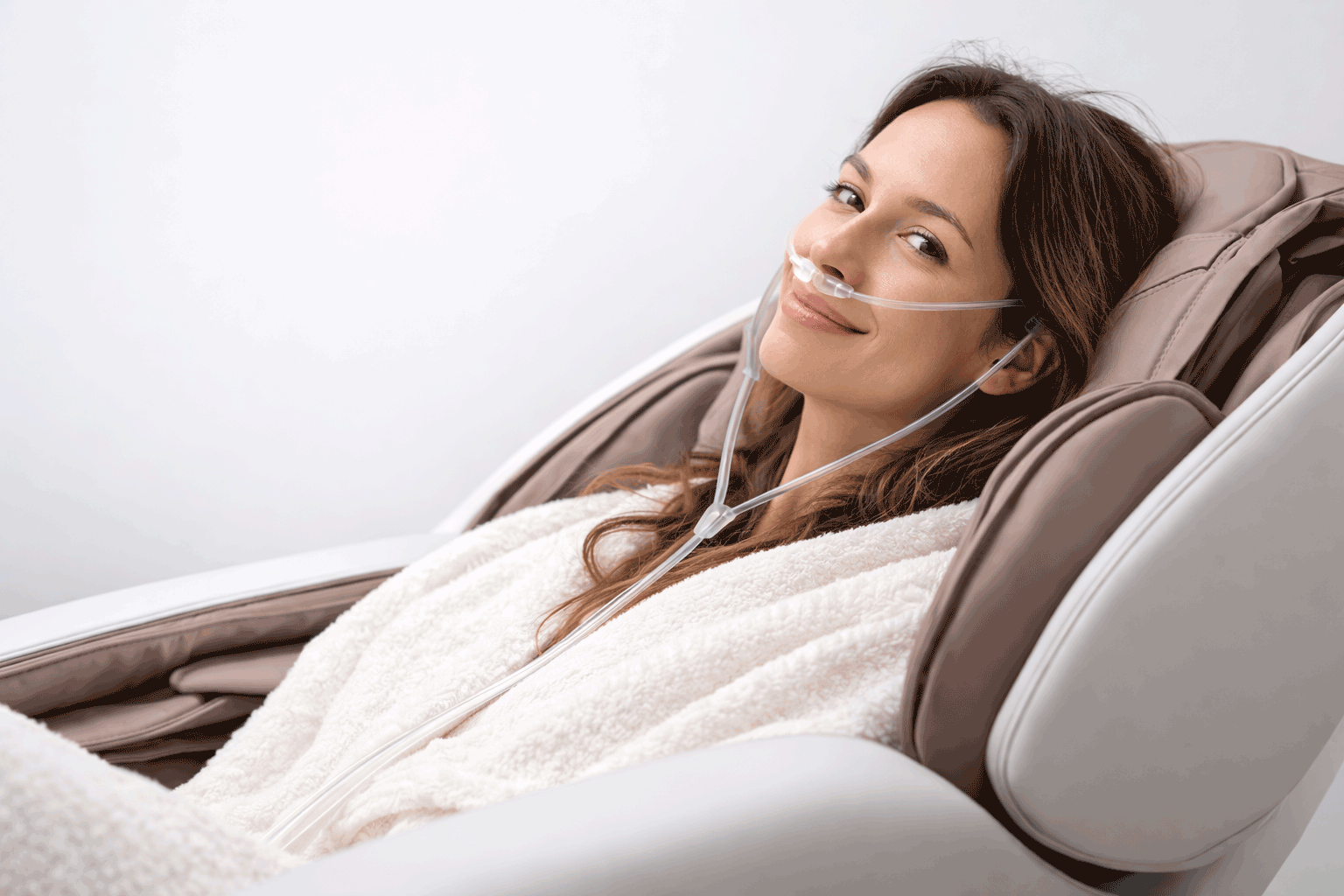 Lady in the massage chair enjoying Hydration-H₂